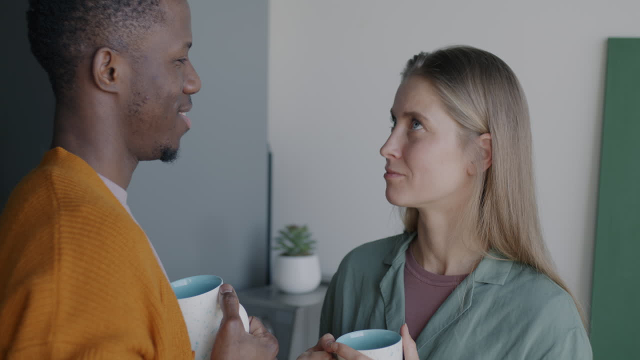 Couple enjoying coffee together at home