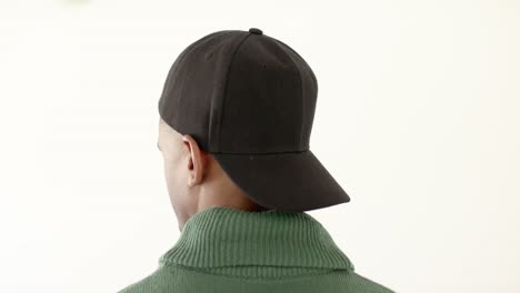 african american man wearing black peaked cap with copy space on white background