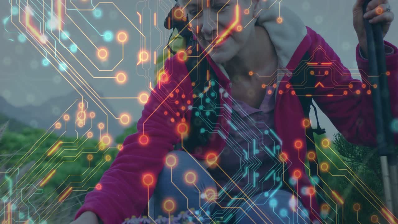 Female hiker kneeling meadow touching flowers causing tech circuit overlay rise near pole for study