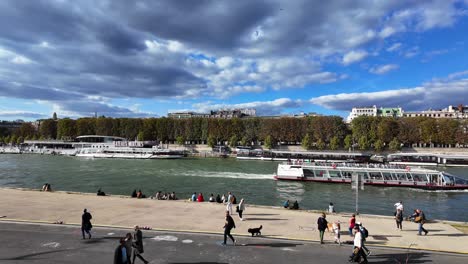 seine river boat paris capital of france with people walking summer day