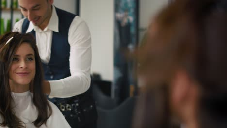 Handheld-view-of-young-woman-has-visit-to-the-hairdresser