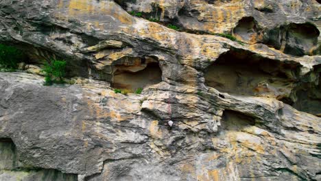 guy climbing top of big mountain