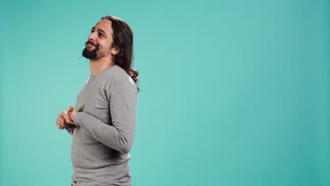 Portrait-of-shy-man-fidgeting-with-fingers-in-his-hair