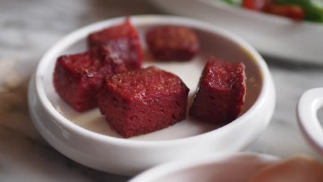 small plate of grilled meat cubes