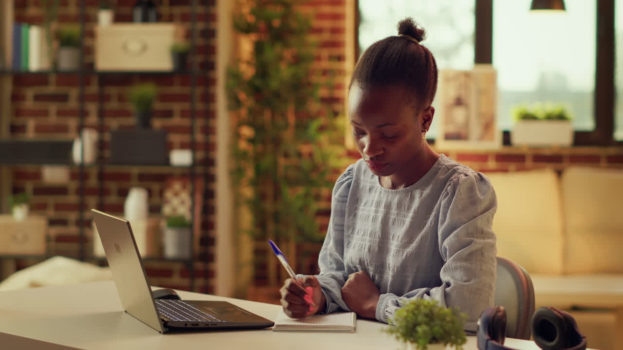 Freelancer taking notes about work