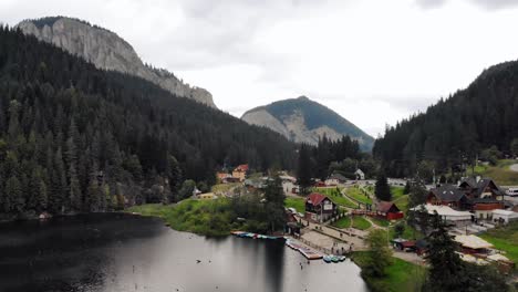boats on the dock of tourist attraction in lacu rosu in romania