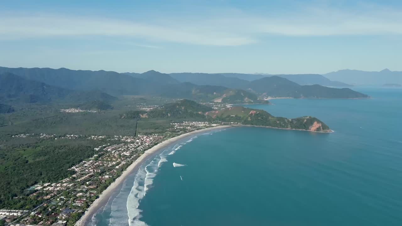 Aerial pan right shot of Barra do Sahy beach, Sao Sebastiao, Brazil