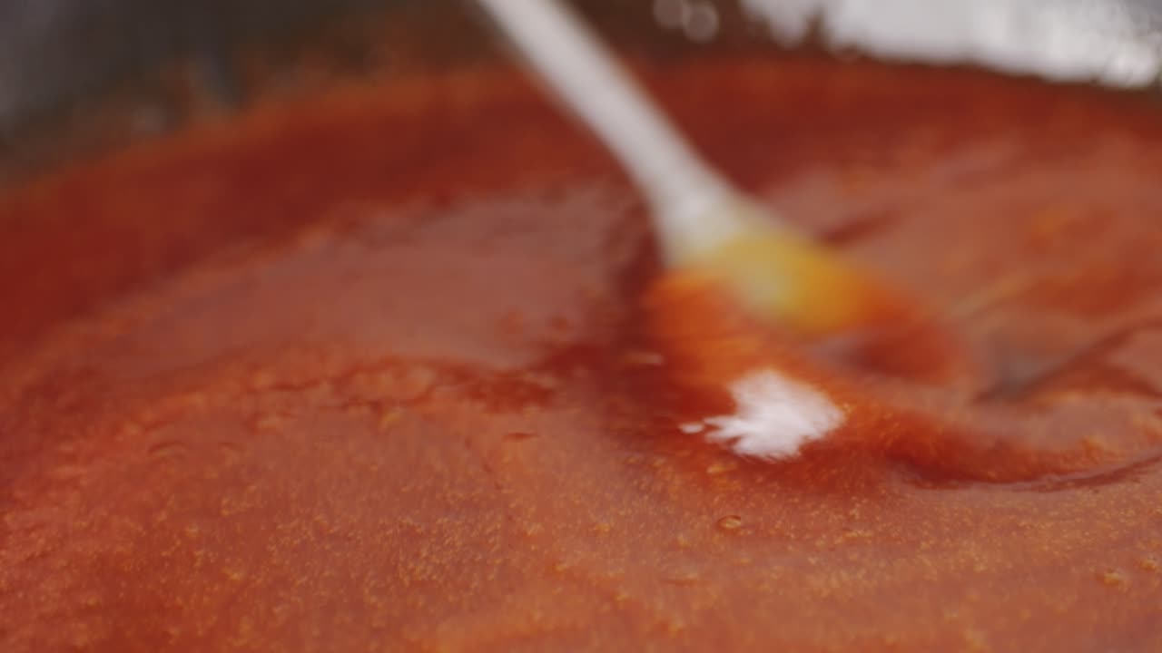 Close up of boiling sugar with bubbles turns into caramel, caramelization, chef cooking dessert in cafe, restaurant pastry food.