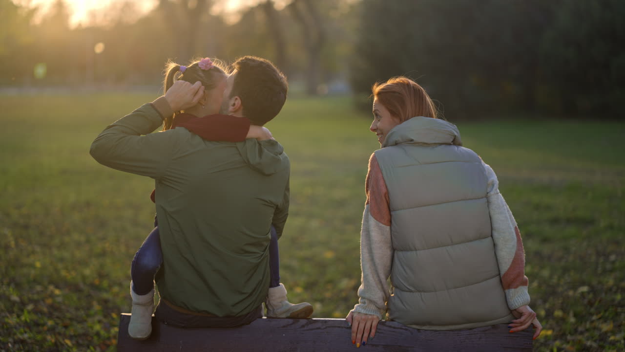 Family enjoying time together in the park during autumn