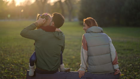 family enjoying time together in the park during autumn