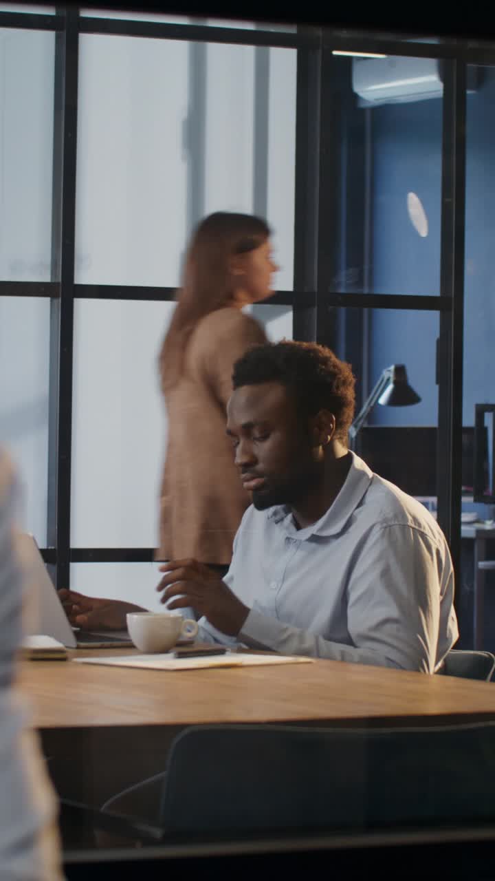Businessman working on laptop in office