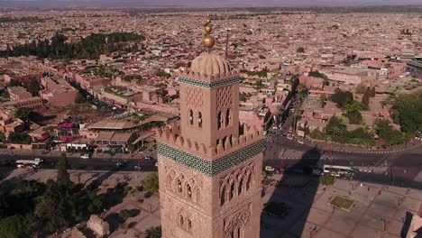 the koutoubia mosque stands as a symbol of marrakech, with its towering minaret visible from the city. it represents islamic architecture and is a key feature of the city's skyline.