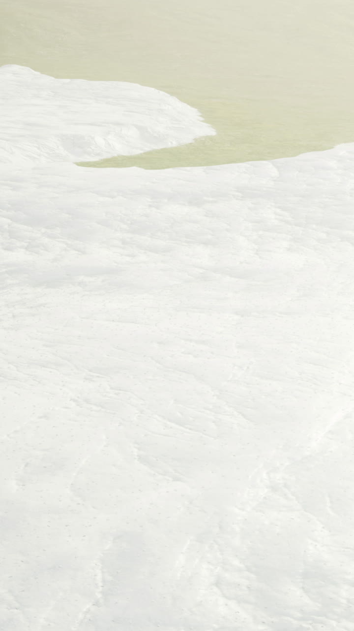 Exploring the vast white landscape under a tranquil sky at dawn