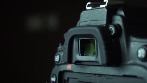 closeup of dslr camera viewfinder and camera buttons