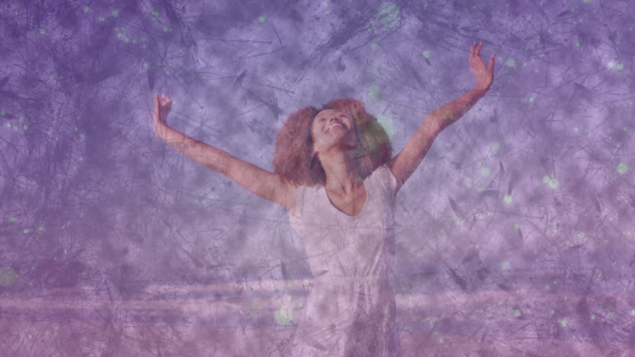 Woman raising arms against purple tech backdrop showing animated scratch textures and green bokeh