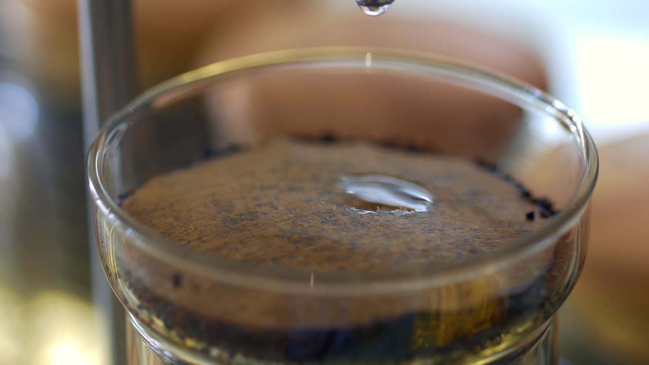 Close-up of Coffee Drip Brewing Process with Water Droplet
