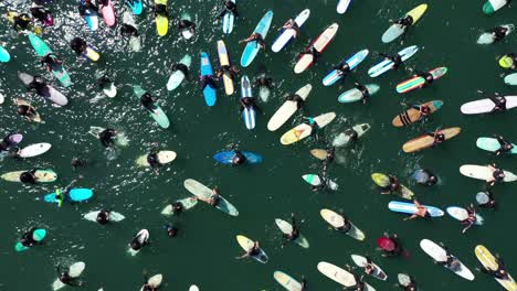 aerial over surfers in circle during blm black lives matter paddle for freedom gathering in california 8