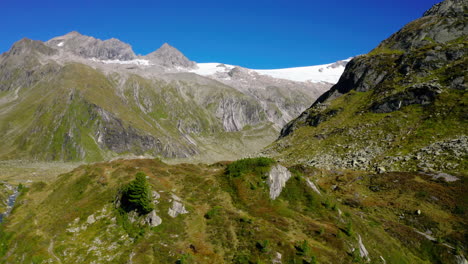 zillertal alps aerial view towards steep alpine valleys and snow capped mountain range