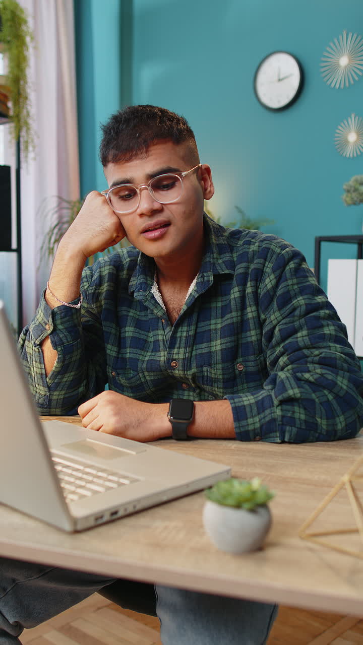 Sad frustrated pensive annoyed man suffers from unfair situation bankruptcy stress at home office