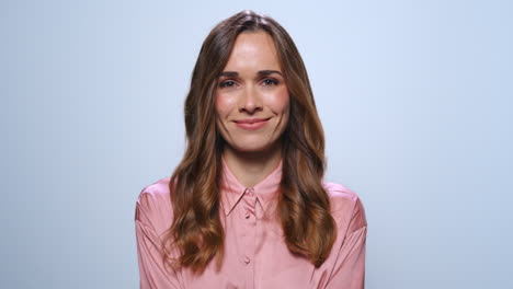 Businesswoman-shaking-yes-with-head.-Entrepreneur-smiling-at-camera-in-studio