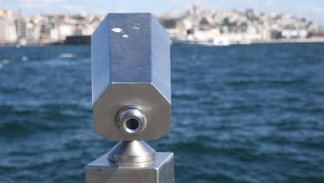 close-up of a telescope on a coastline