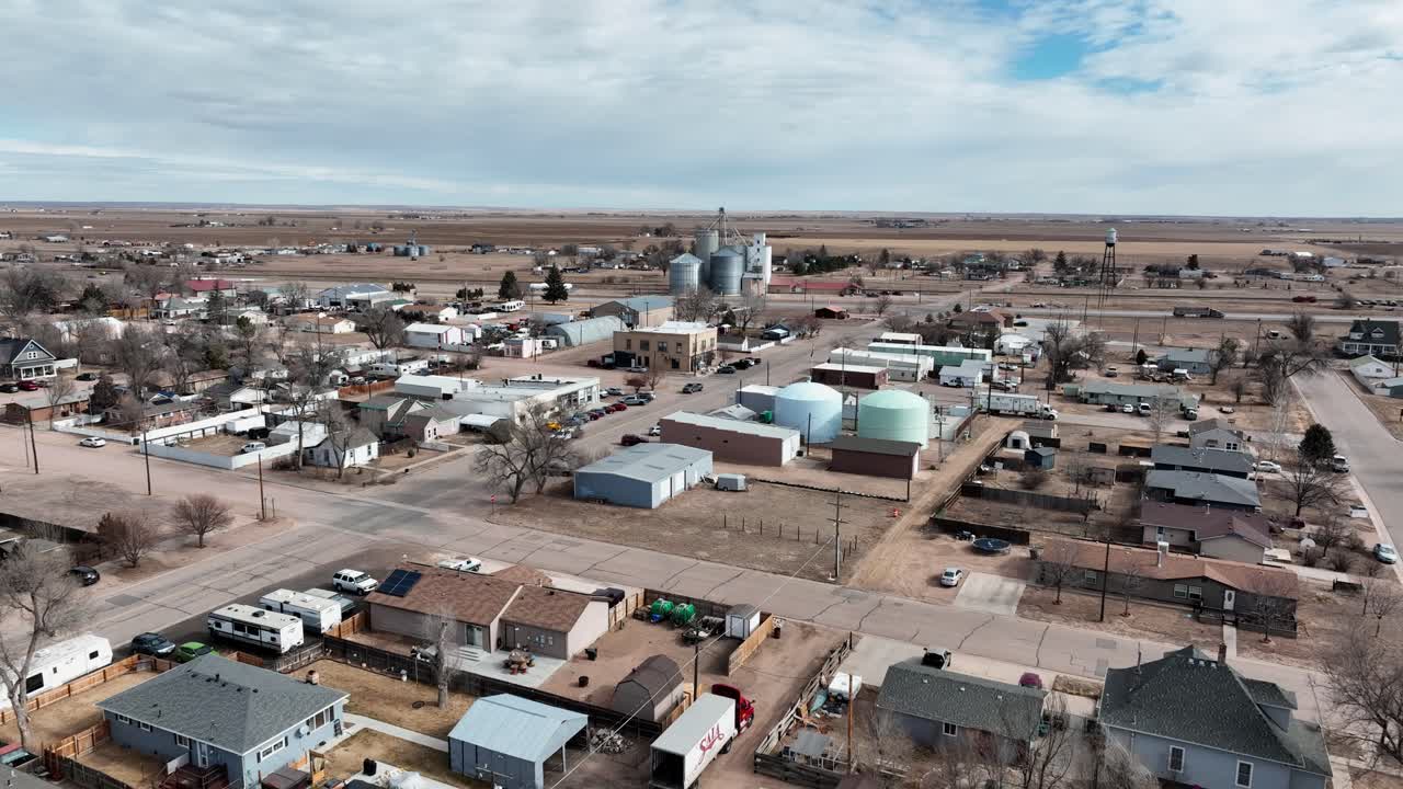 Pierce Colorado drone flight toward grain silos eastward toward the grasslands