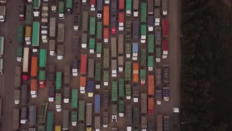 cenital aerial view of a bunch of cargo trucks