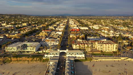 drone flying over crystal pier in pacific beach, san diego california