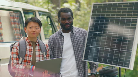 man and woman with solar panel