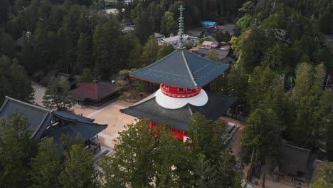 aerial drone fly mount koya temple settlement in wakayama japan trees landscape establishing shot of japanese travel attraction, koyasan