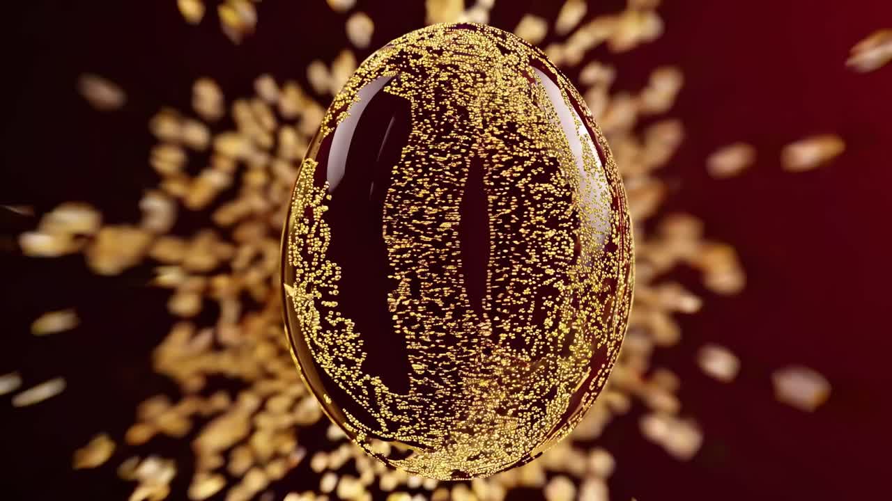 Close-up video of a transparent bubble with golden particles inside, set against a dark red