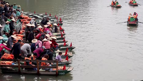 tourists rowing boats on a river