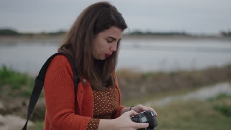 women friends taking photos outdoors