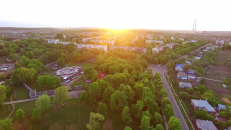 beautiful green city panorama. drone circle movement over the usual city with plain architecture.