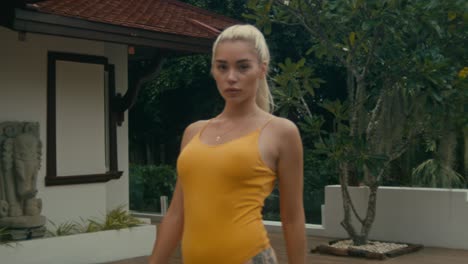 Woman in Yellow Swimsuit by Pool