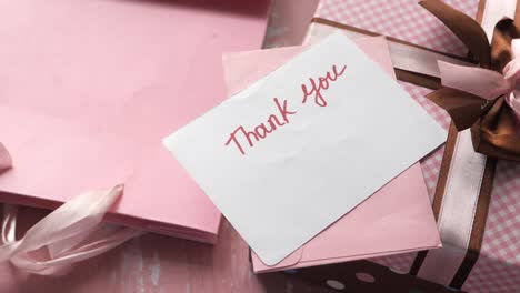 pink gift with thank you note