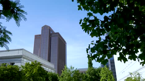 panning to reveal a generic office building highrise in an urban setting