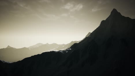 mountains in evening cloudy sky