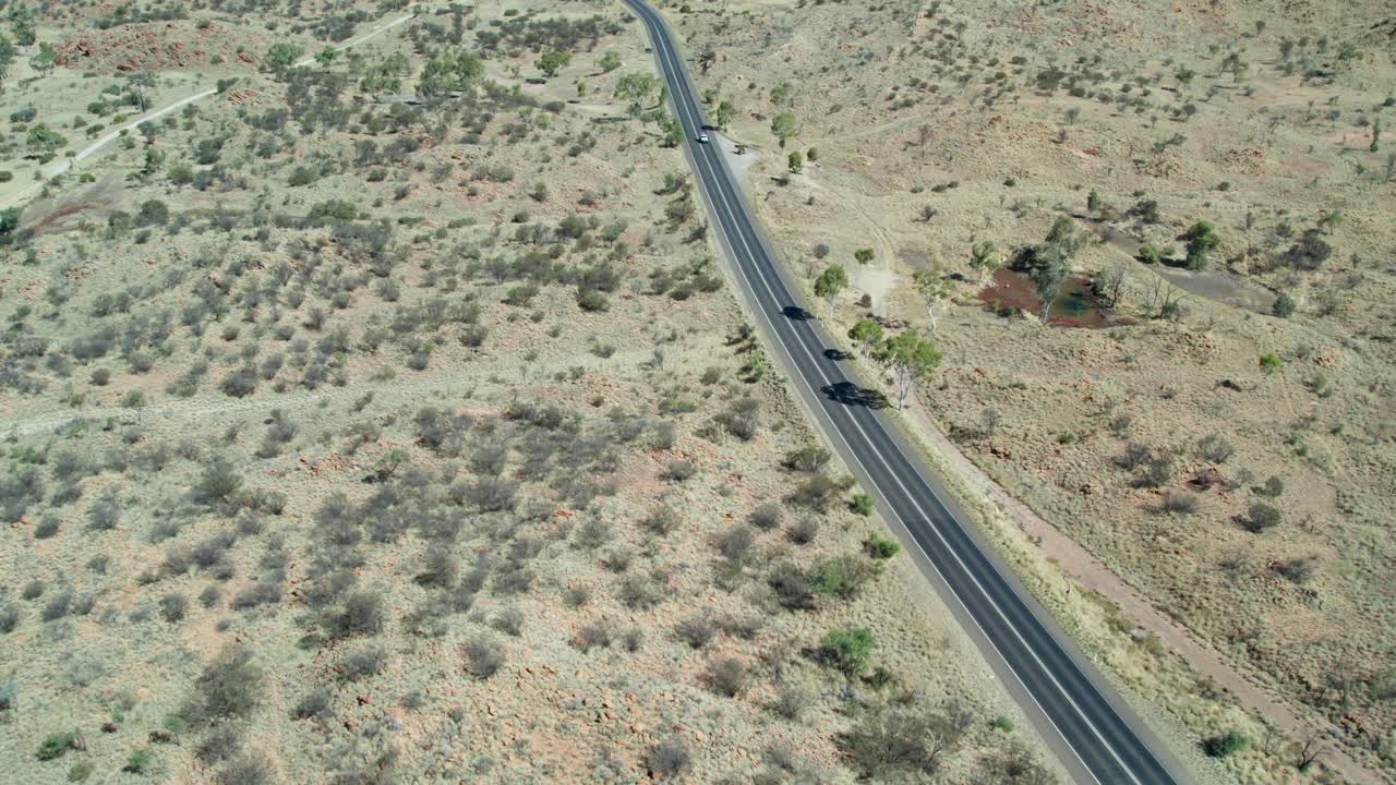 Aerial view looking Stuart Highway at Irlpme, a northern suburb of Alice Springs, Mparntwe, Northern Territory, Australia. August 2022.