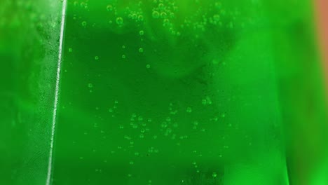 effervescent bubbles in a green beverage