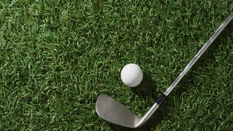 Close-up-of-golf-club-and-ball-on-grass,-copy-space,-slow-motion