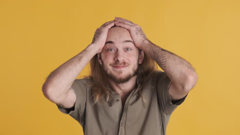 caucasian young man surprised in front of the camera.