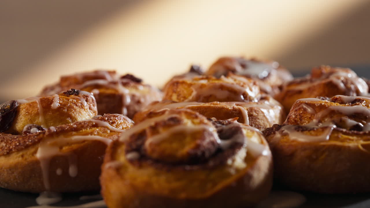 Closeup Of Cinnamon Rolls With Icing.