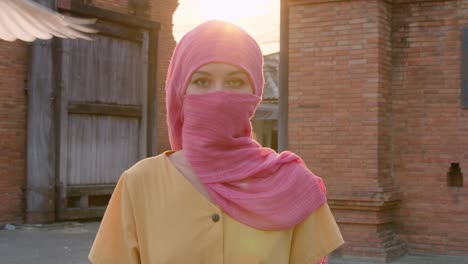 woman in pink hijab outdoors