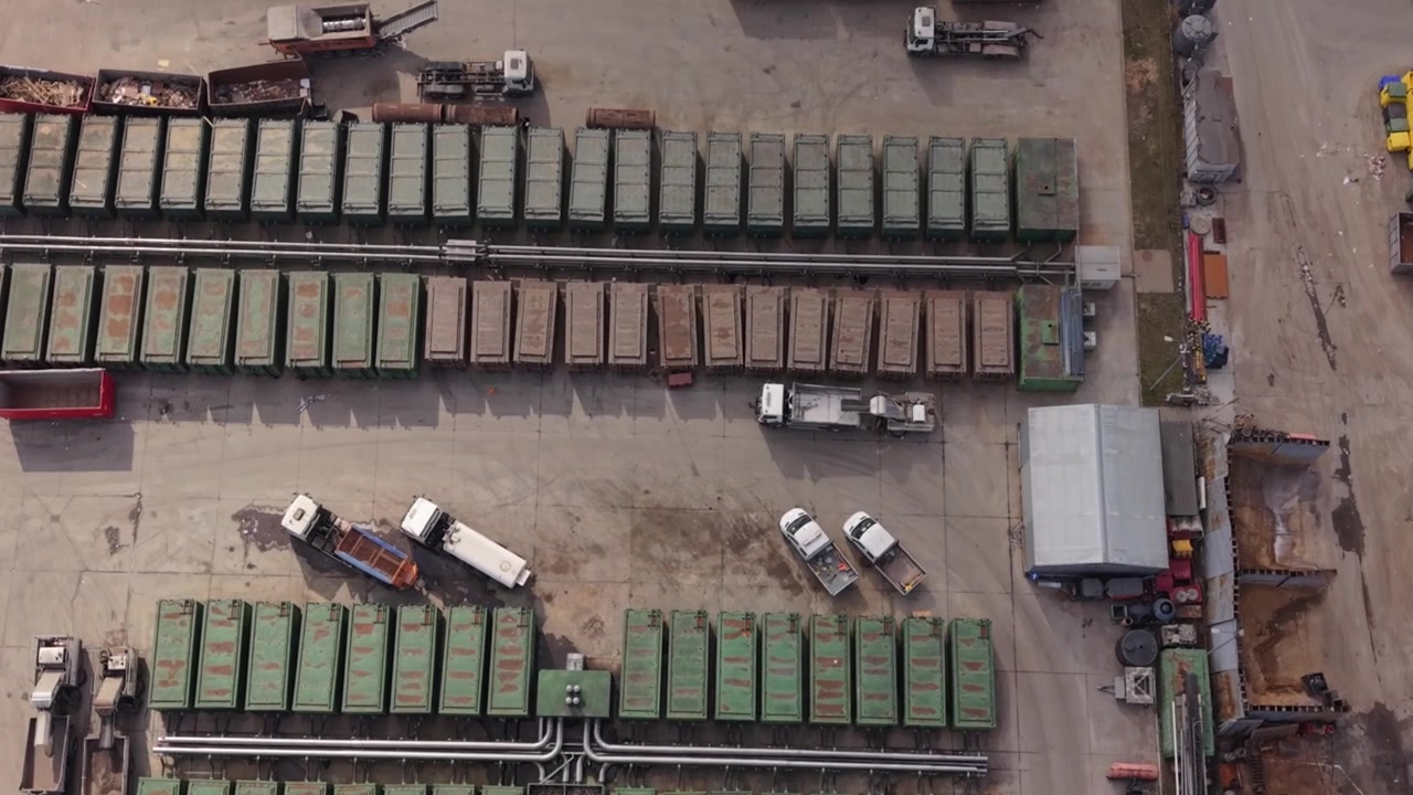 Drone Observes Port. Aerial View Highlights Activity At Bustling Port Facility. Unmanned Aerial Vehicle Provides Observational Perspective On Port Operations And Container Movements