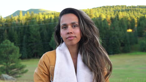 Cinematic-female-women-model-actress-close-up-cute-outfit-jacket-dark-brown-hair-pose-on-tall-fence-yellow-grass-golden-hour-Denver-Evergreen-Conifer-Colorado-open-space-summer-handheld