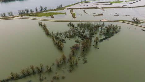 floodwaters inundating the dutch landscape around river waal, poederoijen