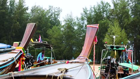 longtail boats on a tropical beach