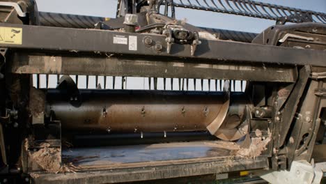 detail of combine harvester platform auger on trailer