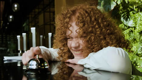 close up view of funny redheaded receptionist behind the counter